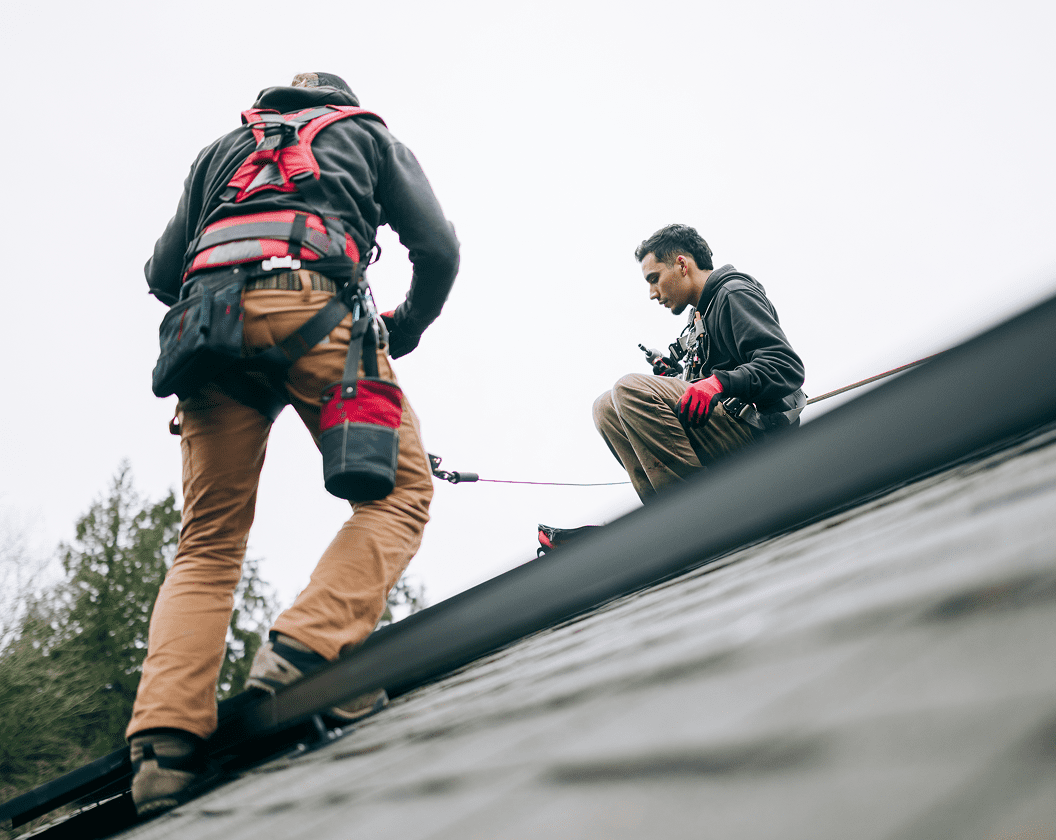 Roofers in safety gear