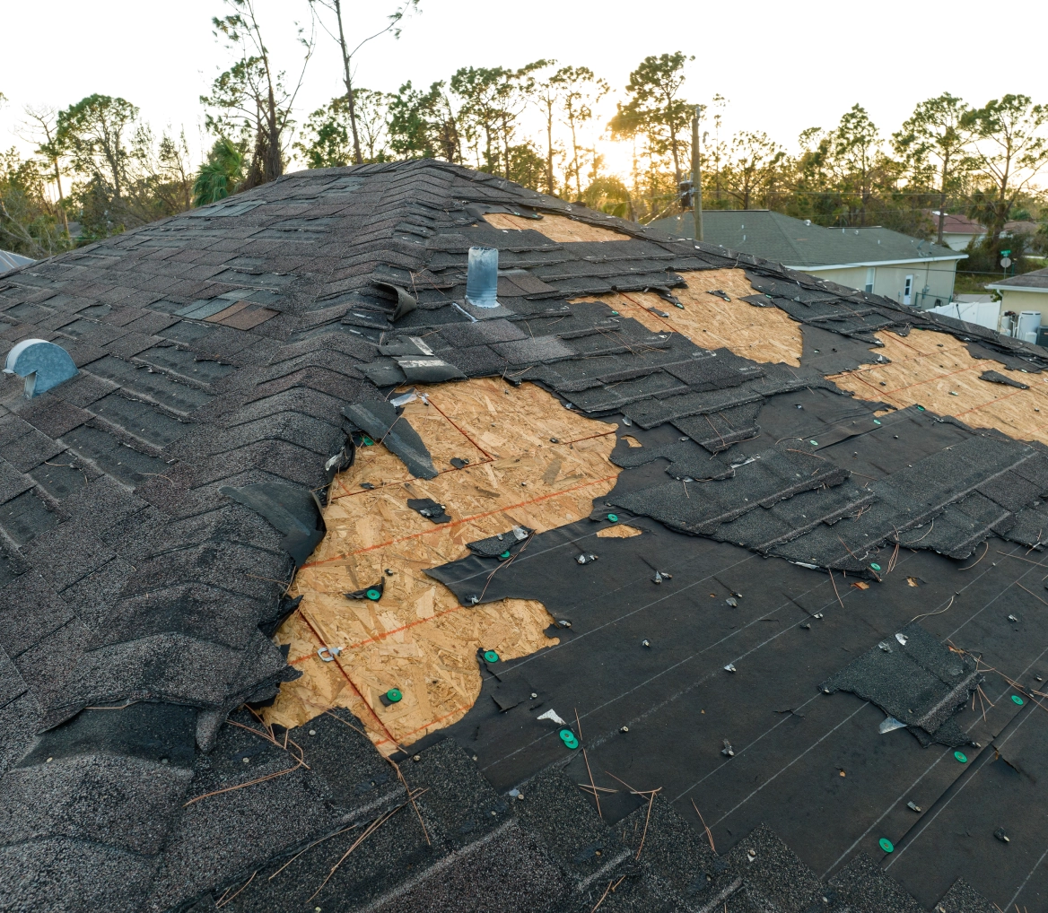 Damaged roof with missing shingles